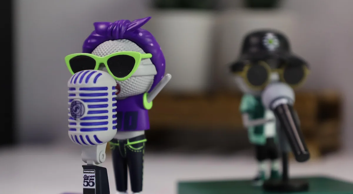 Stylised character figurines with Shure retro microphones