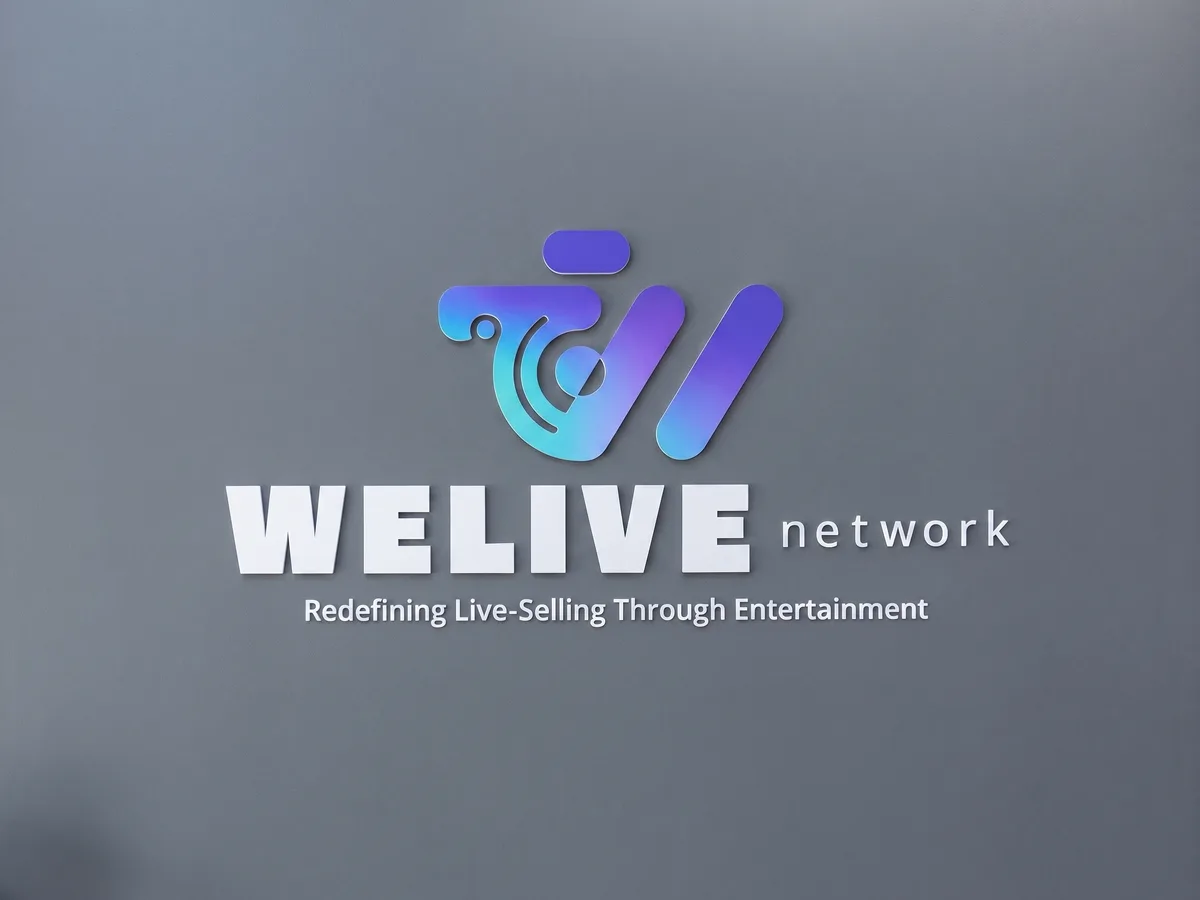 Gradient Welive Network logo sign mounted on a feature wall